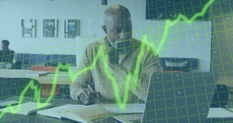 Image of data processing and inflation text over african american businessman using laptop