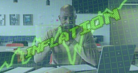 Image of data processing and inflation text over african american businessman using laptop