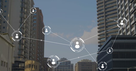 Image of network of conncetions with icons over cityscape
