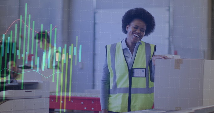 Image of statistics and data processing over african american woman working in warehouse