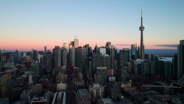 Toronto skyline at sunset, 4K drone shot with CN Tower. Canada.