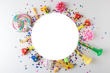 Colorful celebration background with various party confetti, streamers and decoration. Minimal party concept. Flat lay.