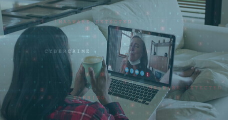Cyber security data processing against woman having a image call on laptop at home