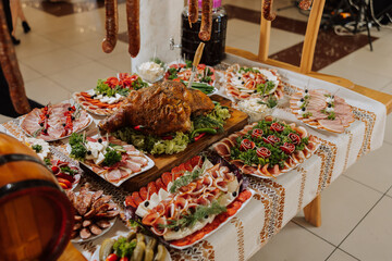 Cossack table. Banquet hall Meat treats for guests. Homemade cutouts. Pork tenderloin. Delicious meat cuts. Meat plate. Delicious compositions from smoked mint. Cottage cheese.