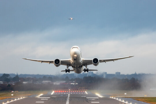 Airplanes taking off and landing during a storm in England