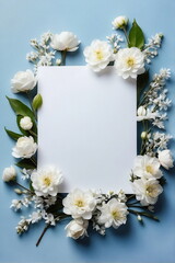 Greeting card mockup and beautiful white flowers frame on blue background top view. copy space. Empty blank sheet card mock up for holiday greetings. women's day, Mother's day, birthday