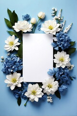 Greeting card mockup and beautiful white blue flowers frame on blue background top view. copy space. Empty blank sheet card mock up for holiday greetings. women's day, Mother's day, birthday