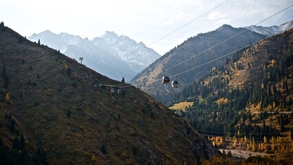 Beautiful autumn landscape of a cable car in the mountains of Almaty on bright day