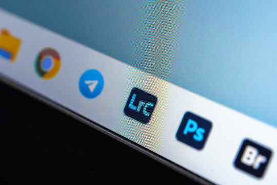 Uzbekistan, Tashkent - January 27, 2024: Application icons for Adobe Photoshop, Bridge and Lightroom on a computer screen with Windows.