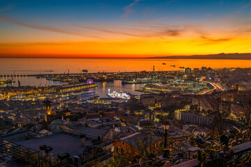 Fototapeta na wymiar GENOA, ITALY, DECEMBER 18, 2023 - Aerial view of the port of Genoa at sunset, Italy