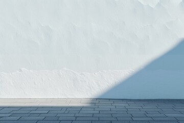 Stark shadow dividing a textured urban wall, perfect for backgrounds and graphic design elements