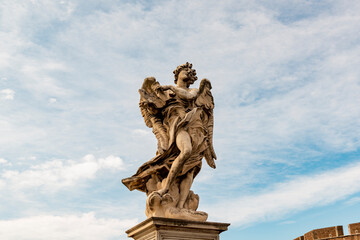 Fototapeta na wymiar Angel statue from Castel Sant Angelo in Rome, Italy. Architecture and landmark of Rome.