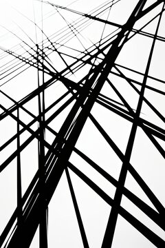it is a black and white photo of a power line , generated by AI
