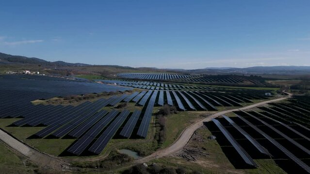 Expansive Solar Farm In Rural Portugal Landscape - Aerial Descend