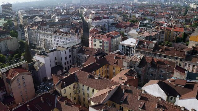 Scenic flight over roofs in Sofia, Bulgaria, establishing medieval balkan city