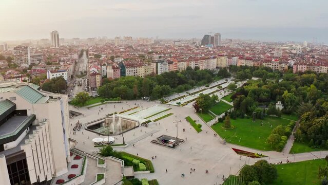 Many skateboarder in famous park in Sofia, Bulgaria, aerial establisher skyline