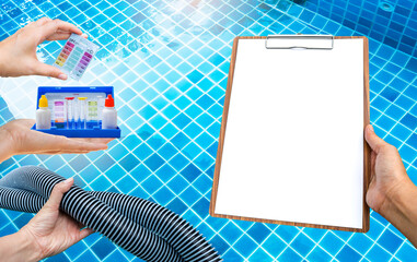Pool tester test kit and vacuum hose with report paper on clipboard in girl hand over clear...