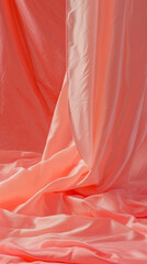 Elegant coral fabric, flowing with graceful folds and soft texture, silk background