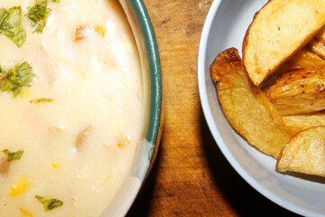 photo of cream soup and potato wedges, common breaakfast menu in western culture