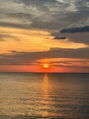 Beautiful sunset at tropical beach with sand and sky for traveling and relax