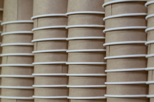 stacks of paper glasses prepared for use in a cafe