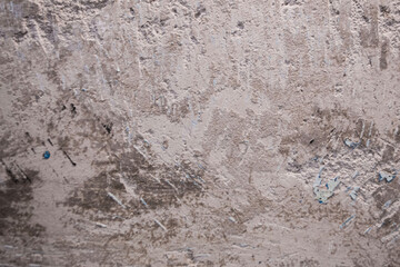 texture of a concrete wall with the problem of removing old oil paint from the surface coating, for...
