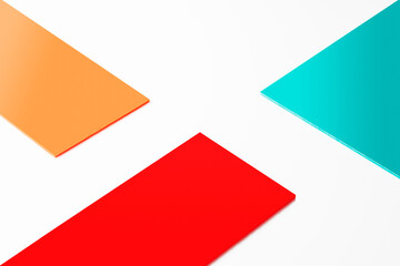Orange, blue and red geometric layers on white background with copy space