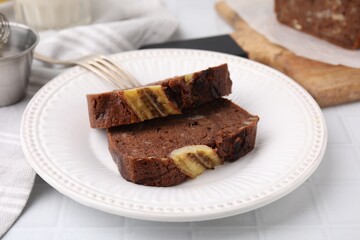 Slices of delicious banana bread served on table, closeup