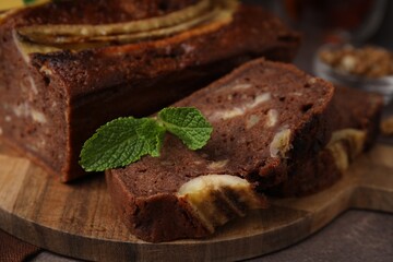 Delicious banana bread on brown table, closeup