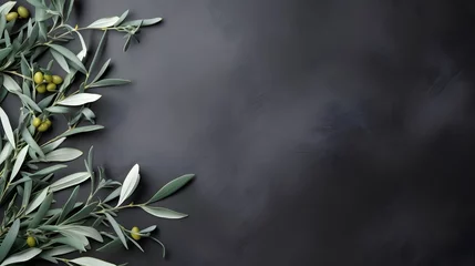 Tuinposter Wild olive branches on gray background. Copy space.  © Ziyan