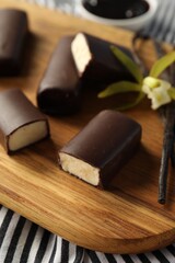 Glazed vanilla curd cheese bars on table, closeup