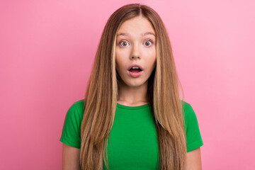 Photo portrait of charming teen girl look amazed camera dressed stylish green clothes isolated on pink color background
