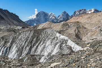 View of Сairn, pile of stones, ice, snow, Taboche and Cholatse mountains and Khumbu Glacier from Everest Base Camp during EBC, Three Passes trekking in Khumjung, Nepal. Highest mountains in the world