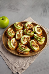 Homemade Apple Brie Crostinis on a Plate, side view. Close-up.