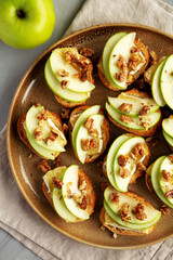 Homemade Apple Brie Crostinis on a Plate, top view. Flat lay, overhead, from above.