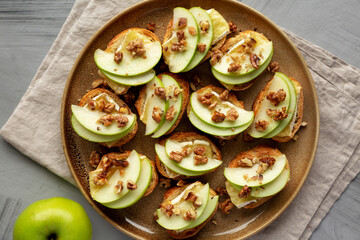 Homemade Apple Brie Crostinis on a Plate, top view. Flat lay, overhead, from above.