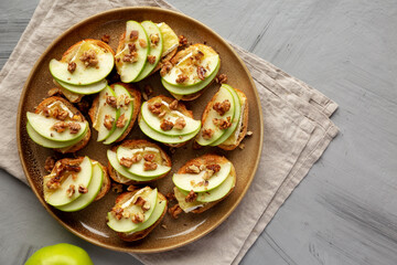 Homemade Apple Brie Crostinis on a Plate, top view. Copy space.