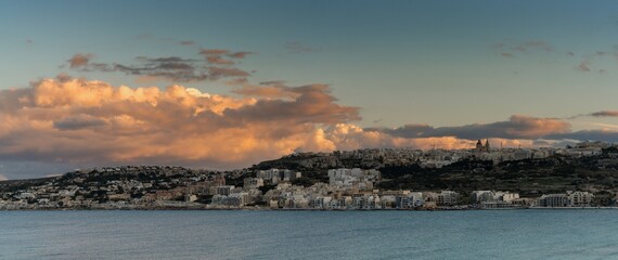 panorama landscape view of Mellieha Bay in Malta at sunset