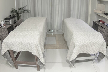 spa room with two massage tables