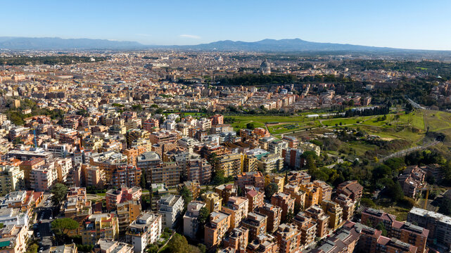 Aerial view of the Balduina neighborhood in Rome, Italy. In the background the dome of St. Peter's Basilica in Vatican City. In the foreground Monte Ciocci and Ettore Scola park.