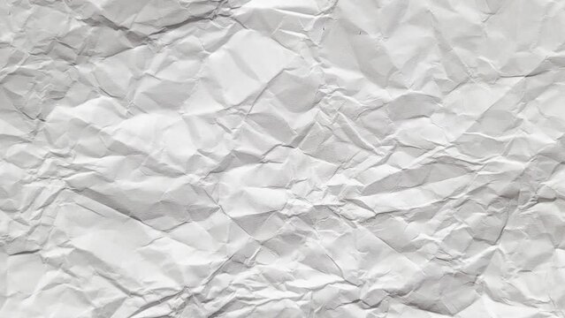 Stop motion animated paper texture background. Seamless looping Crumpled White Paper 4k.