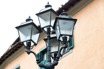 ancient street lamps typical of a country in Italy