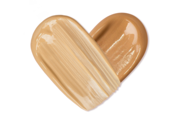 Smears of foundation in the shape of a heart on a blank background