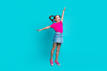 Full length photo of flying girl wear stylish t-shirt denim skirt hands like wings look empty space...