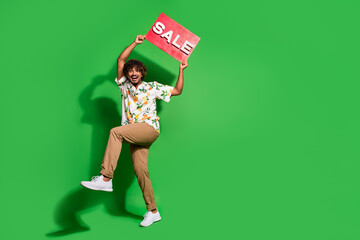 Full length photo of handsome young guy hold excited sale plate wear trendy citrus print garment...