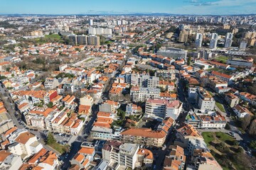 Overlapping Skies and Urban Spires: A Mesmerizing Aerial Tapestry of Portos Downtown