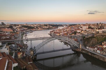 Transcendent Reflections: Luminary Dom Lus I Bridge Illuminating Portos Riverside Splendor