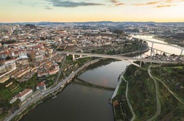 Ethereal Elegance: A Mesmerizing View of Dom Lus I Bridge Gracefully Arched Over the Majestic Douro...