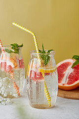 Detox vitaminized water. Summer aesthetic drink with citrus. Lemon, grapefruit, orange, mint. Low alcohol, hard seltzer, zero proof beverages