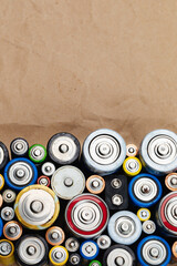 Assorted Used Batteries on a Brown Paper